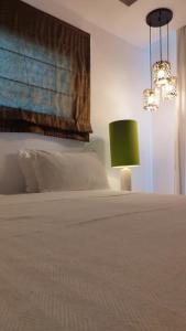 Postel nebo postele na pokoji v ubytování Salvator Villas & Spa Hotel