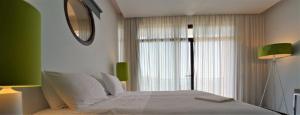 Postel nebo postele na pokoji v ubytování Salvator Villas & Spa Hotel