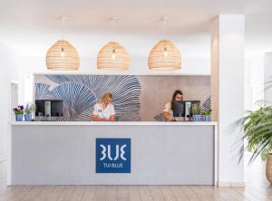 two women sitting at the counter of a tu clinic at Grupotel Rocador - Adults Only in Cala d´Or +42 photos