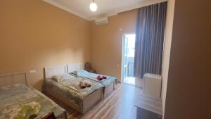 Letto o letti in una camera di Grand Hotel Kobuleti