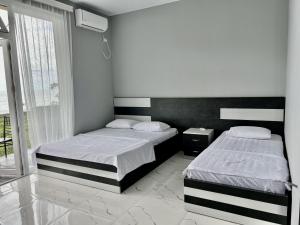 Letto o letti in una camera di Grand Hotel Kobuleti