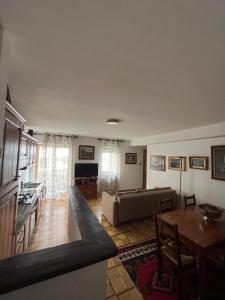 a living room with a couch and a table at Paradiso delle Nevi in Sestriere