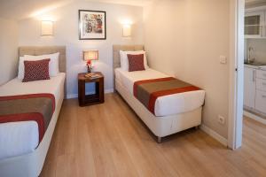 A bed or beds in a room at Cheya Sisli BNB Medical & Business City Center Tesvikiye Suites and Apartments