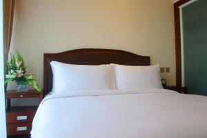 Katil atau katil-katil dalam bilik di Kantharyar Serviced Apartment