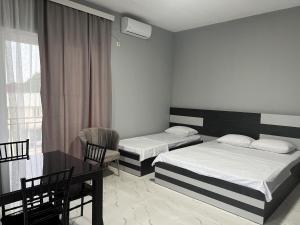 Letto o letti in una camera di Grand Hotel Kobuleti