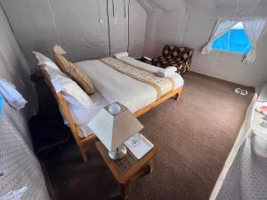 an overhead view of a bed in a small room at Ladakh Mountian Escape Camp by LexStays in Leh