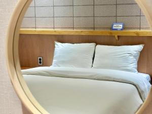 Postel nebo postele na pokoji v ubytování Ciel mini hotel