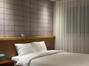 Postel nebo postele na pokoji v ubytování Ciel mini hotel