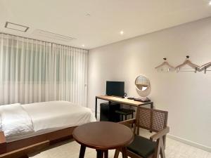 Postel nebo postele na pokoji v ubytování Ciel mini hotel