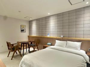 Postel nebo postele na pokoji v ubytování Ciel mini hotel