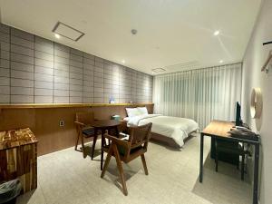 Postel nebo postele na pokoji v ubytování Ciel mini hotel