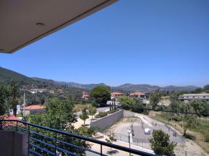 a view of a city from a balcony at The Beekeeper's Apartment in Kymi