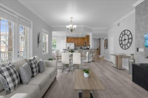 a living room and kitchen with a couch and a table at 3 Bedrooms 2 Bathrooms Reunion 7521-104 Md in Kissimmee