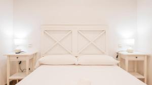 En eller flere senge i et værelse på La Corrala de Pozo Amargo - Apartamentos Aloha Toledo