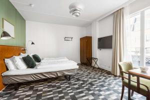 Postel nebo postele na pokoji v ubytování Hotel Astoria, Best Western Signature Collection