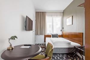 TV a/nebo společenská místnost v ubytování Hotel Astoria, Best Western Signature Collection