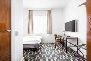TV a/nebo společenská místnost v ubytování Hotel Astoria, Best Western Signature Collection