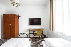 Postel nebo postele na pokoji v ubytování Hotel Astoria, Best Western Signature Collection