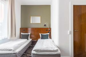 Postel nebo postele na pokoji v ubytování Hotel Astoria, Best Western Signature Collection