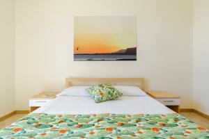 Postel nebo postele na pokoji v ubytování Oasi Kite - Stagnone Apartments