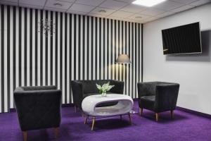 Televízia a/alebo spoločenská miestnosť v ubytovaní Best Western Plus Hotel Olsztyn Old Town