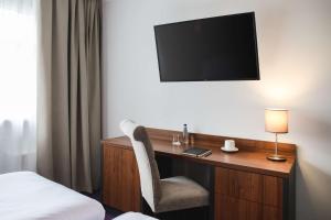 Televízia a/alebo spoločenská miestnosť v ubytovaní Best Western Plus Hotel Olsztyn Old Town
