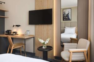 Televízia a/alebo spoločenská miestnosť v ubytovaní Best Western Plus Hotel Olsztyn Old Town