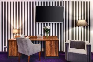 Televízia a/alebo spoločenská miestnosť v ubytovaní Best Western Plus Hotel Olsztyn Old Town