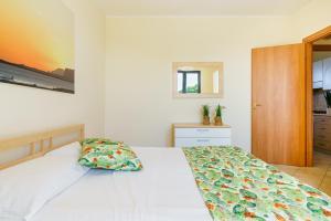 Postel nebo postele na pokoji v ubytování Oasi Kite - Stagnone Apartments