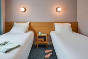 Postel nebo postele na pokoji v ubytování Sure Hotel by Best Western Centre Beaune