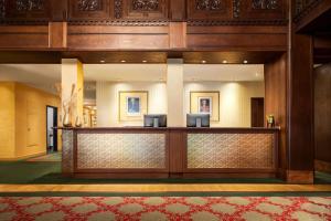 a lobby of a hotel with a reception desk at Vienna House by Wyndham Thüringer Hof Eisenach in Eisenach