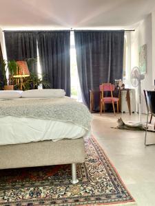 Postel nebo postele na pokoji v ubytování Suite con giardino Ravenna