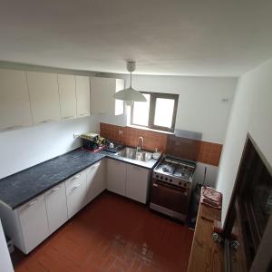 Kuchyň nebo kuchyňský kout v ubytování Cabana PUFI + 12 fotografií