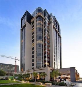 a tall building with a lot of windows at Sandton Skye Apartments in Johannesburg