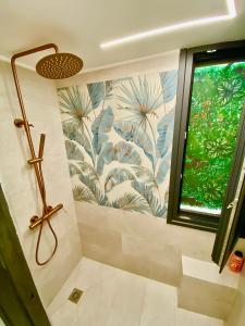 a bathroom with a shower and a window at Sophia Loft Luxury Stay with Parking in Athens