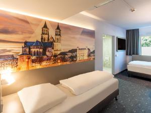 Postel nebo postele na pokoji v ubytování B&B HOTEL Magdeburg-Barleben