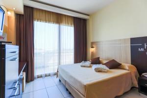 Postel nebo postele na pokoji v ubytování Hotel King - Azzurro Club