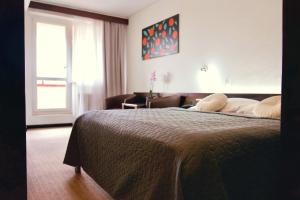 Ένα ή περισσότερα κρεβάτια σε δωμάτιο στο Hotel Merkur - Jablonec nad Nisou
