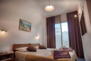 Postel nebo postele na pokoji v ubytování Hotel King - Azzurro Club