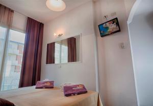 TV a/nebo společenská místnost v ubytování Hotel King - Azzurro Club