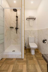 a bathroom with a shower and a toilet at Design Apartments with Panoramic View in Kyiv