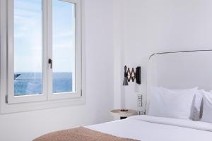 Cama ou camas em um quarto em Porto Mykonos