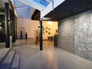a hallway with a tile floor and a ceiling at reiminski Abenteuer Space Kapseln, Tennis Squash Soccer, Sport & Wellness in Bergen
