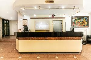 a lobby with a bar with a sign on it at Ametyst Hotel Praha in Prague