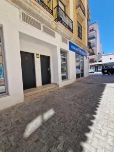 an empty street in front of a building at Urban suite 1 in Málaga