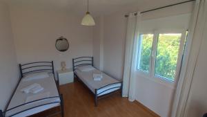 Posteľ alebo postele v izbe v ubytovaní Aliki Serenity Cottage