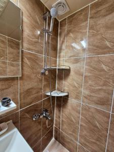 a bathroom with a shower with a sink at MIN Stay - Woman Only Homestay in Seoul +25 photos