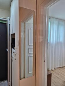 a door with a mirror in a room at MIN Stay - Woman Only Homestay in Seoul