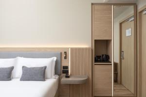 Кровать или кровати в номере Courtyard by Marriott Milano Linate