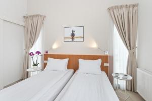 Postel nebo postele na pokoji v ubytování Villa 21 by Victus